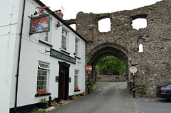The Boot and Shoe public house and the remains of the caslte gatehouse, Kidwelly.